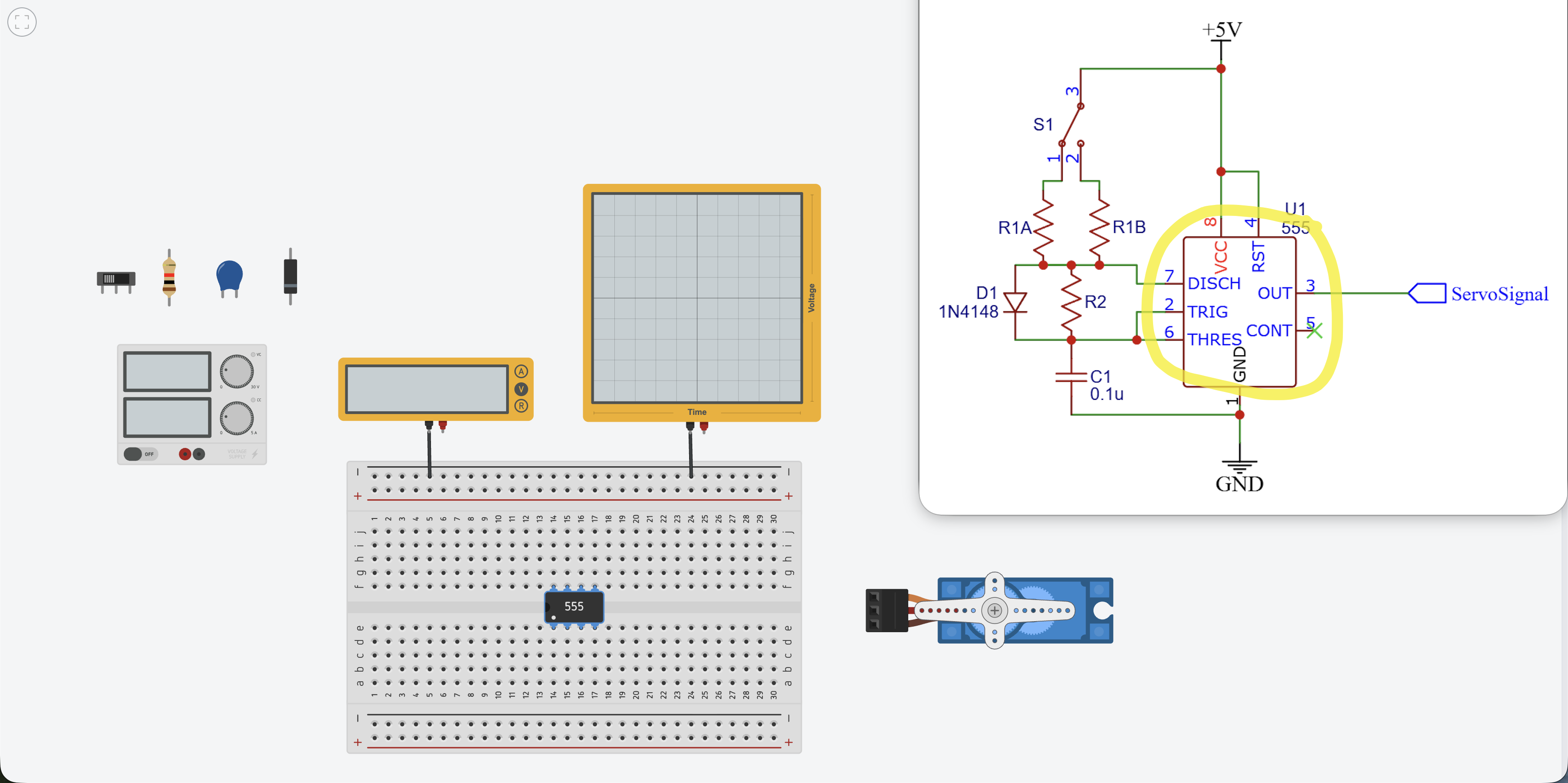 555 timer chip placed in the center of the breadboard, straddling the center gap
