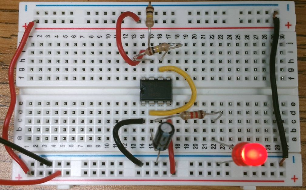 555 timer flasher circuit on breadboard