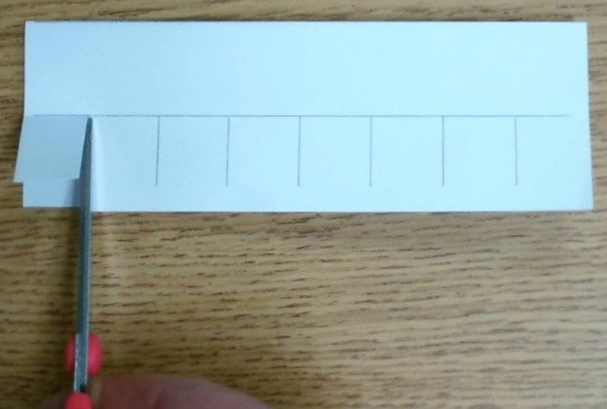 Cutting the top flap along the vertical lines